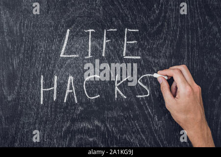 life hacks written on the blackboard using chalk Stock Photo