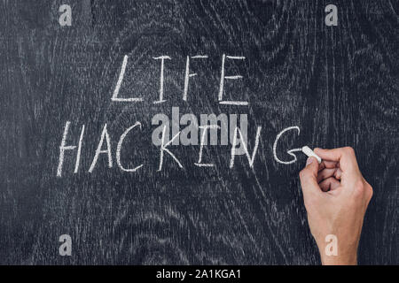 life hacks written on the blackboard using chalk Stock Photo