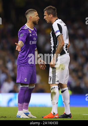 Sergio Ramos of Real Madrid and Mario Mandzukic of Juventus clash