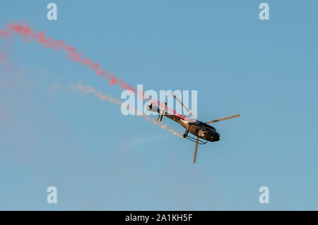 Athens Greece, September 21 2019: Greek Helicopter performing aerobatics on the air during the Athens Flying  week 2019 at Tanagra airport in Greece. Stock Photo