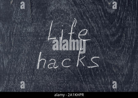 life hacks written on the blackboard using chalk Stock Photo