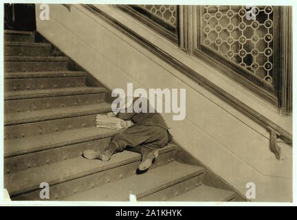 Newsboy asleep on stairs with papers. Stock Photo