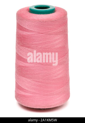 Spool of pink synthetic or cotton threads isolated on white background. Spool of yarn using for weaving in textile manufacturing Stock Photo