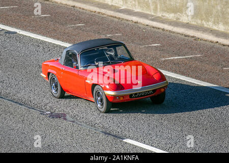 1972 70s seventies red Lotus Elan; UK Vehicular traffic, transport, 70s sports cars, south-bound on the 3 lane M6 motorway highway. Stock Photo