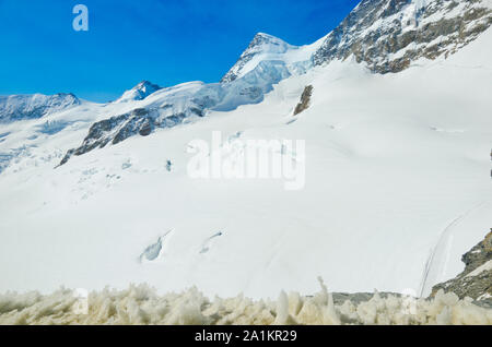 Alps Eiger and Jungfrau dramatic snowy mountain peaks panorama Switzerland. Stock Photo