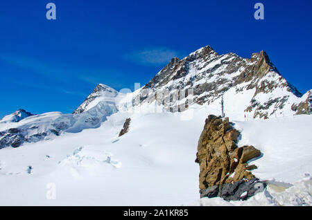 Alps Eiger and Jungfrau dramatic snowy mountain peaks panorama Switzerland. Stock Photo