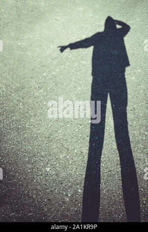 Silhouette of a woman pointing Stock Photo - Alamy