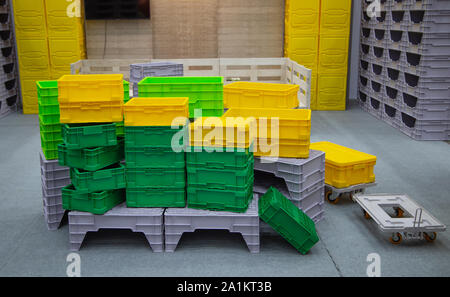 Stack of colorful empty plastic crate container Stock Photo