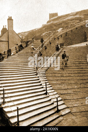 A Victorian photo of the 199 stone steps, (aka the Church Stairs) leading to the parish church and Abbey at Whitby, North, Yorkshire UK. Fishermen's nets can be seen drying on the railings whilst a man with a donkey is climbing the Donkey Road, or Loning/ Loneing that ascends the hill alongside the 199 steps. Stock Photo