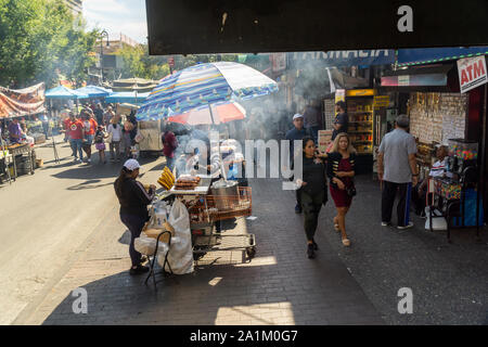 Street vendors in the busy Jackson Heights neighborhood in Queens in New York on Saturday, September 21, 2019. The Jackson Heights neighborhood is home to a mosaic of ethnic groups  which include Hispanics, Indians, Pakistanis, Tibetans, Southeast Asian as well as long-time Jewish and Italian residents.  (© Richard B. Levine) Stock Photo