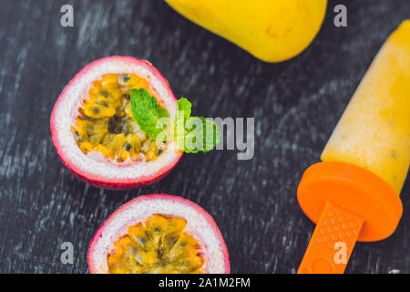 Homemade ice cream from mango and passion fruit. Popsicle Stock Photo