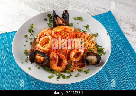 Greek Seafood pasta in red sauce Stock Photo