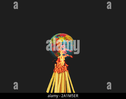 Concept of Climate change or Global warming showing with burning the globe or earth on black background Stock Photo
