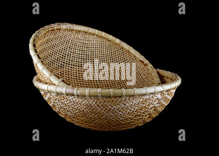 Hand made bamboo baskets from Sarawak Borneo isolated on a black background Stock Photo