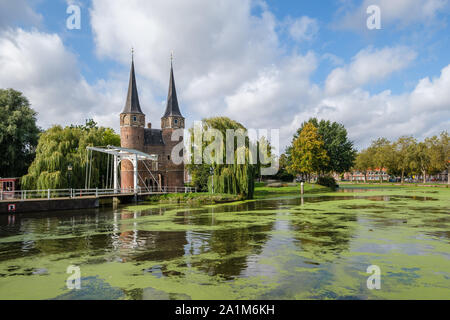 Historical Eastern Gate and drawbridge over the canal in Delft, Netherlands. This gate build around 1400 is the only remaining city gate of Delft. Stock Photo