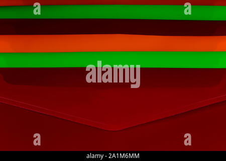 Stacked coloured plastic office document folders Stock Photo
