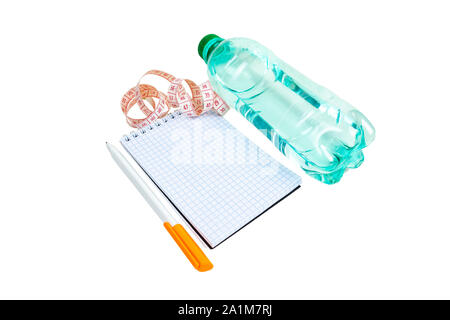 Notebook, pen, measuring tape, water bottle, on a white background. Stock Photo