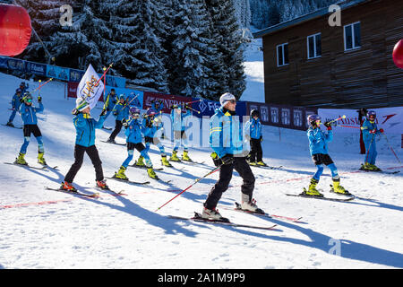 Bansko, Bulgaria - December, 12, 2015: Opening new ski season 2015-2016 in Bansko, Bulgaria. Young skiers at the slope Stock Photo