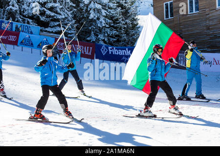 Bansko, Bulgaria - December, 12, 2015: Opening new ski season 2015-2016 in Bansko, Bulgaria. Young skiers at the slope Stock Photo