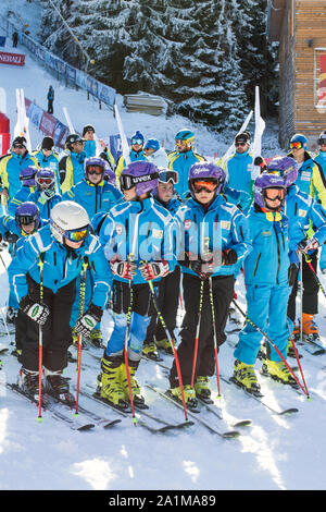 Bansko, Bulgaria - December, 12, 2015: Young skiers at opening new ski season 2015-2016 in Bansko resort, Bulgaria Stock Photo