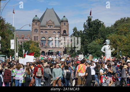 Toronto, Canada - September 27, 2019:  The Climate Strike attracted large crowds of young people in front of the Ontario Parliament Stock Photo