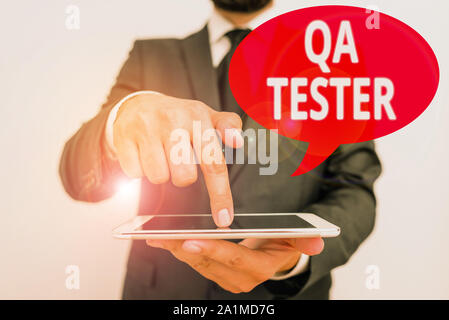 Word writing text Qa Tester. Business photo showcasing Quality assurance of an on going project before implementation Stock Photo