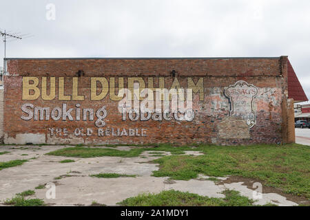 old bull durham tobacco poster Old Bull Durham tobacco advertising poster in Giddings, the seat of Lee  County, Texas, east of Austin Stock Photo