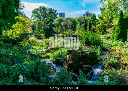 Green Summer Scene with Bridge and Water at the Lincoln Park Zoo in Chicago Stock Photo