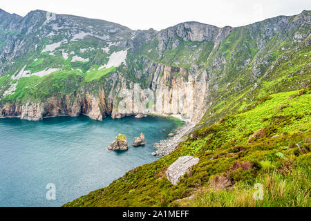 Rugged coastline and the cliffs of Slieve League in County Donegal, Ireland on a cloudy day. Stock Photo