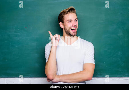 idea comes. private teaching. back to school. university online courses. education abroad. college life. young tutor. teachers day. man at blackboard. get knowledge here. student man in classroom. Stock Photo