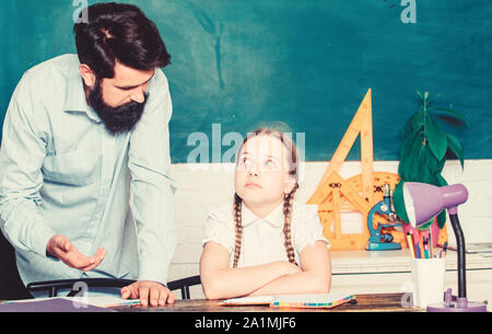 help and support. education child development. daughter study with father. Teachers day. bearded man teacher with small girl in classroom. back to school. knowledge day. Home schooling. Stock Photo