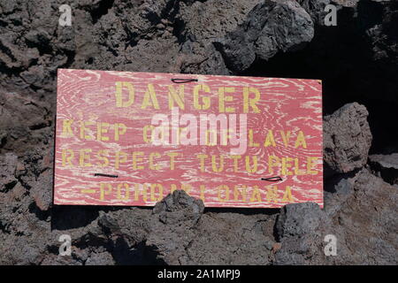 Danger sign at Isaac Hale Beach Park warns to keep off of lava out of respect for Tutu Pele, Goddess of Volcanoes and Fire. Stock Photo