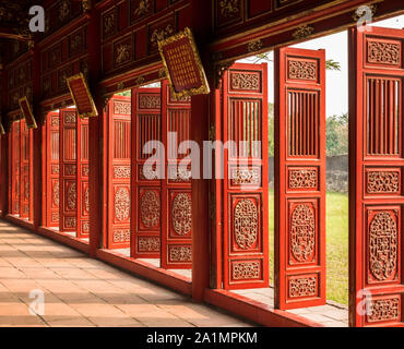 Decorated red doors of corridor at Imperial City of Hue, Vietnam, oblique view