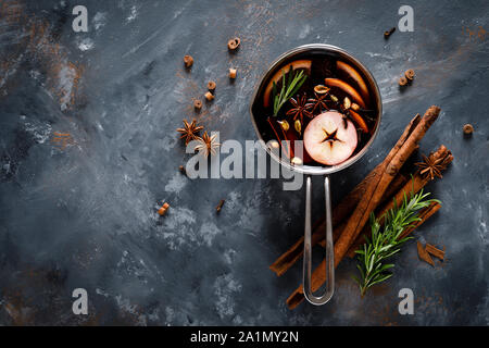 Christmas mulled wine with spices. Traditional winter festive drink at holiday, top view Stock Photo