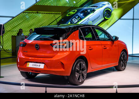 FRANKFURT, GERMANY - SEPT 2019: red OPEL CORSA-E small electric hatchback, IAA International Motor Show Auto Exhibtion. Stock Photo