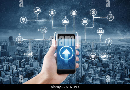 Hand holding mobile smartphone connect to internet data and online application Stock Photo