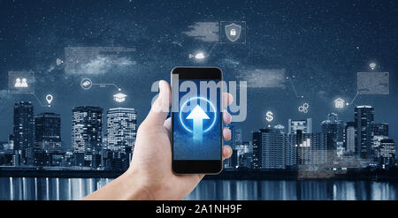 Hand holding mobile smartphone connect to internet data and online application Stock Photo