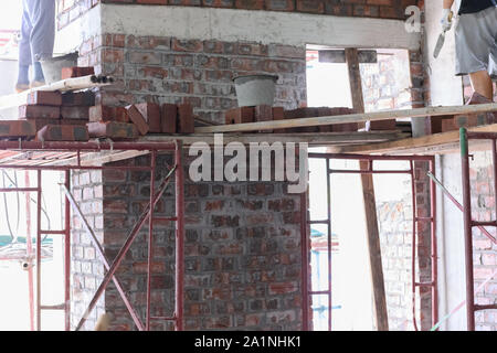 plasterers making up brick walls Stock Photo