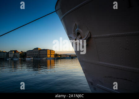 STOCKHOLM, SWEDEN - SEPTEMBER 17, 2019: View of the Swedish National Museum building reflecting in the sea water early in the morning in autumn Stock Photo