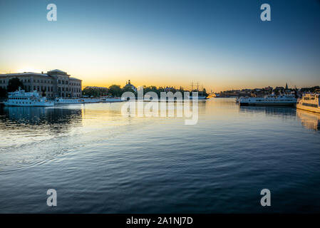 STOCKHOLM, SWEDEN - SEPTEMBER 17, 2019: View of the Swedish National Museum building reflecting in the sea water early in the morning in autumn Stock Photo