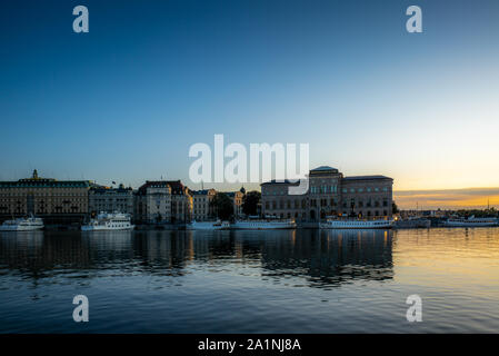STOCKHOLM, SWEDEN - SEPTEMBER 17, 2019: View of the Swedish National Museum building reflecting in the sea water early in the morning in autumn Stock Photo