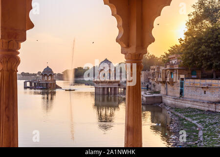 Gadisar lake on sunset. Man-made water reservoir with temples in Jaisalmer. Rajasthan. India Stock Photo