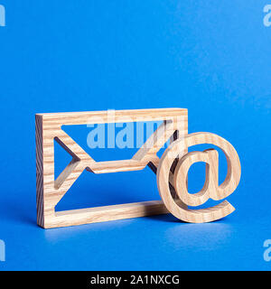Envelope and email symbol on a blue background. Concept email address. Internet technologies and contacts for communication. Communication over the ne Stock Photo