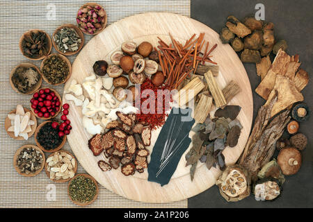 Acupuncture needles with chinese herbs for use in alternative herbal medicine. Flat lay. Stock Photo