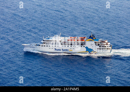 FUNCHAL, MADIERA - SEPTEMBER 2019: Aerial view of ferryboat 'Lobo Marinho' navigating in direction to Porto Santo Island from Madeira island. Stock Photo