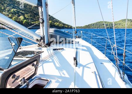 Sailing boat near Croatian island Lastovo. View from the deck of the yacht. Vacation on a boat. Sailing on the sea. Stock Photo