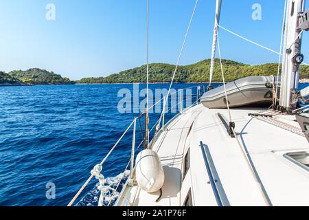 Sailing boat near Croatian island Lastovo. View from the deck of the yacht. Vacation on a boat. Sailing on the sea. Stock Photo
