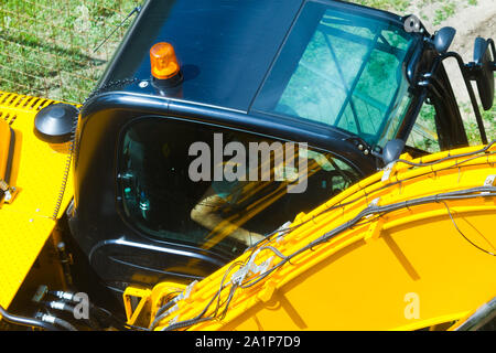 Tractor close up. Yellow construction machine close up Stock Photo