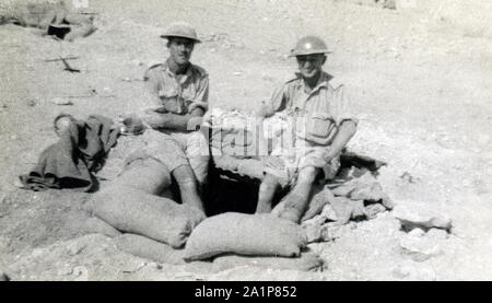 Photographs taken during WW2 by British soldier of the Royal Tank Regiment during the North Africa campaign. 2 British soldiers outside a dugout at Tobruk, 1941.  Trooper C M Shoults Stock Photo