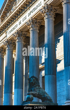 Congress building of the deputies of Spain, with a statue of two lions that for its creation was with the Cast of cannons taken to the enemy in the Wa Stock Photo